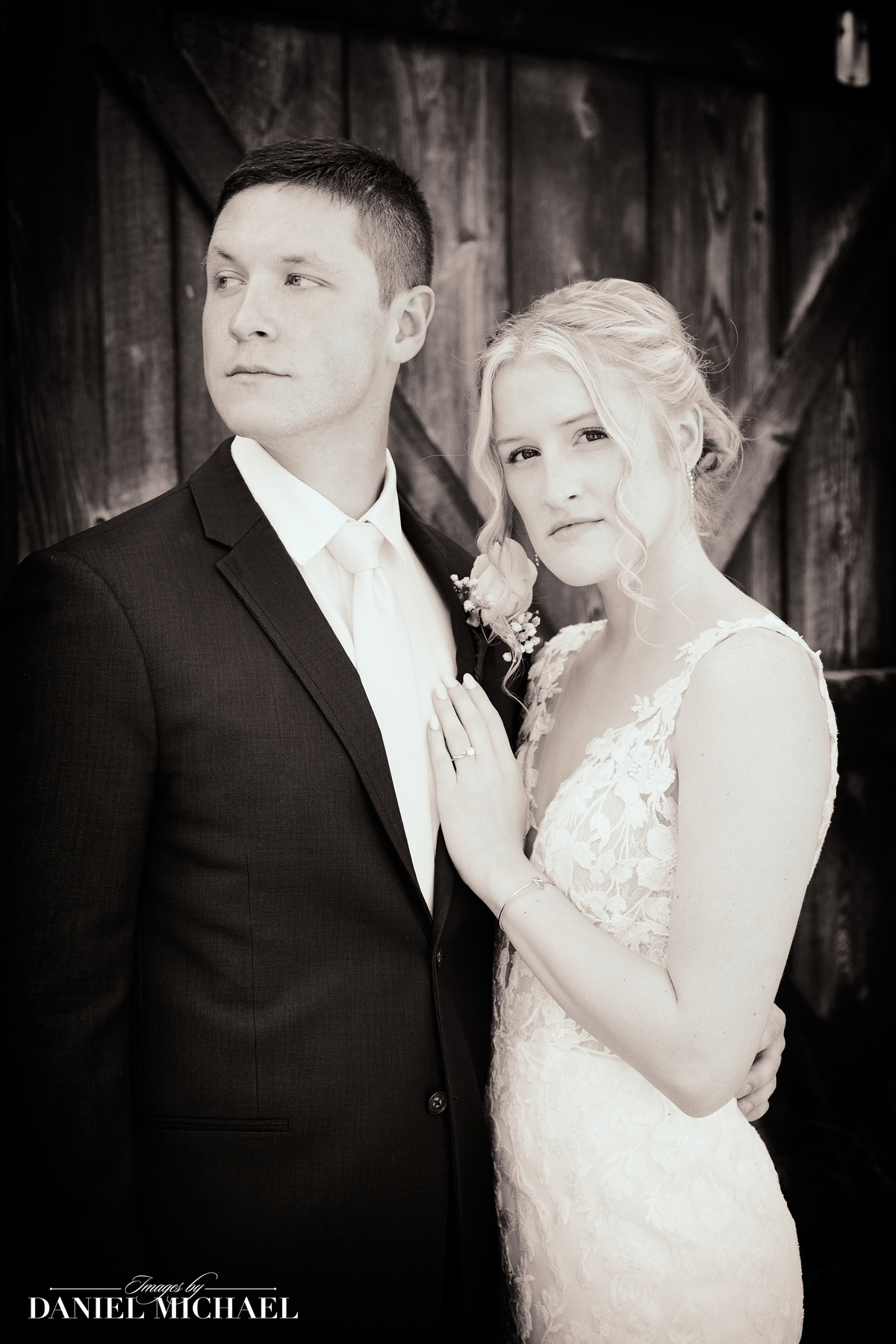 a groom dancing with his bride on an ornate, stone bridge